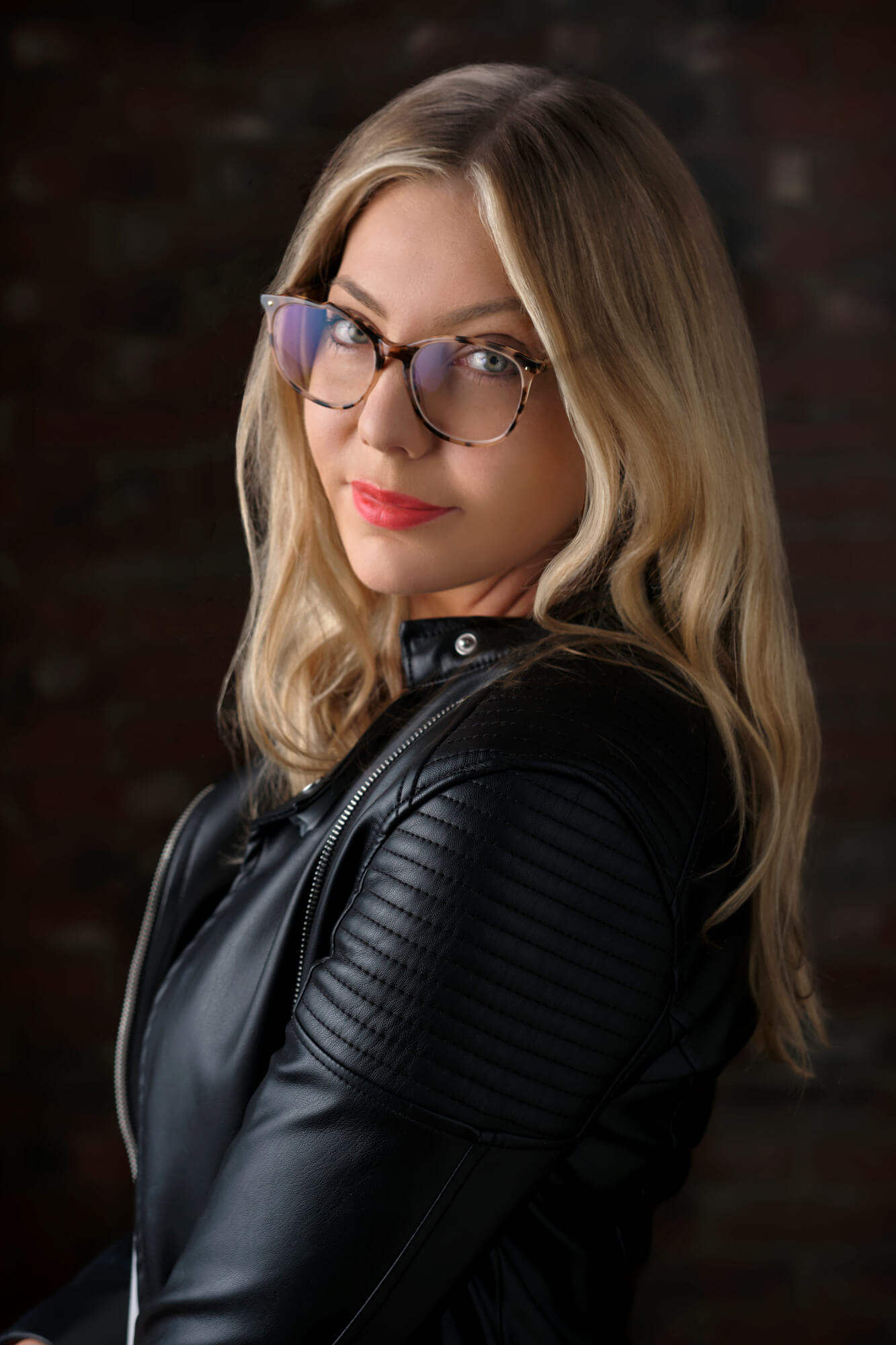 Portrait of writer Lana Hall looking over her shoulder