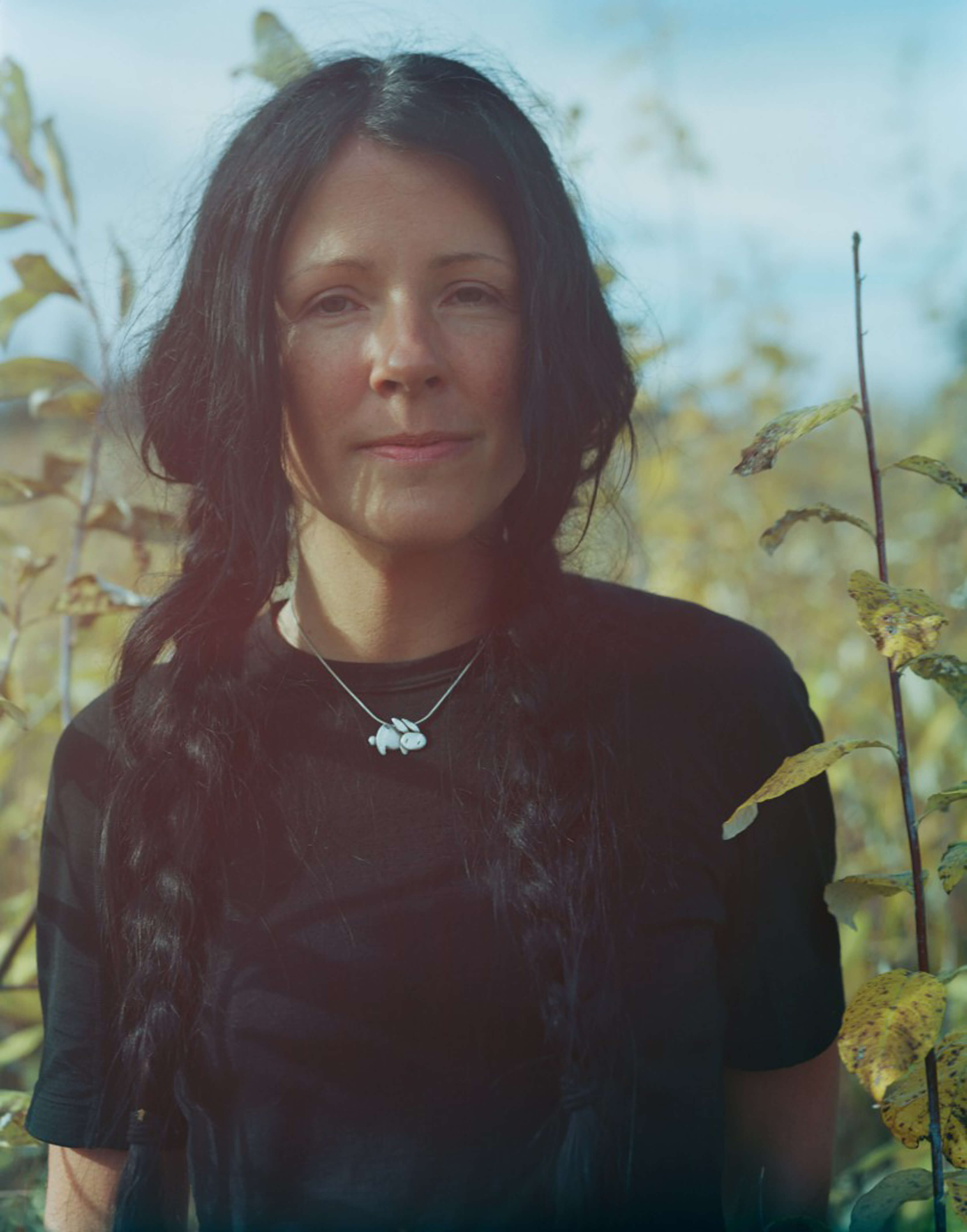 A portrait of the author in a field.