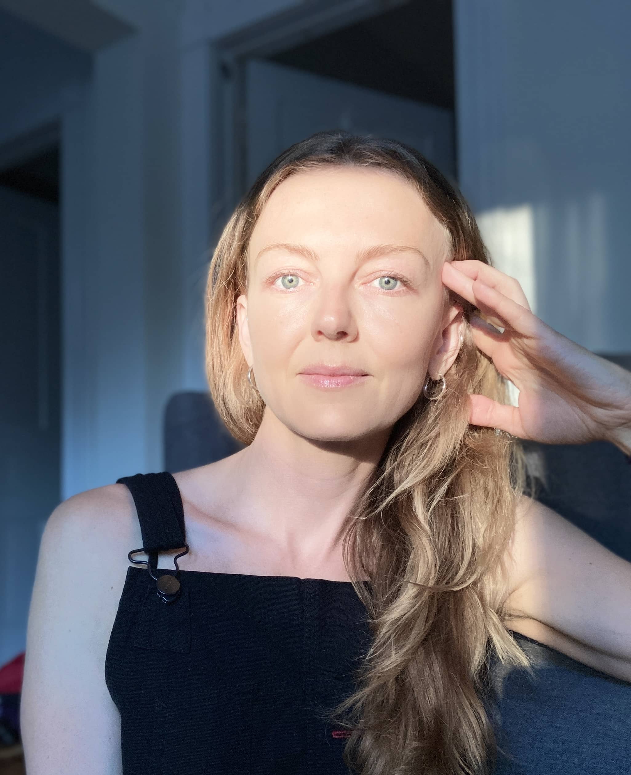Writer Allison LaSorda facing the camera, her face bathed in sunlight