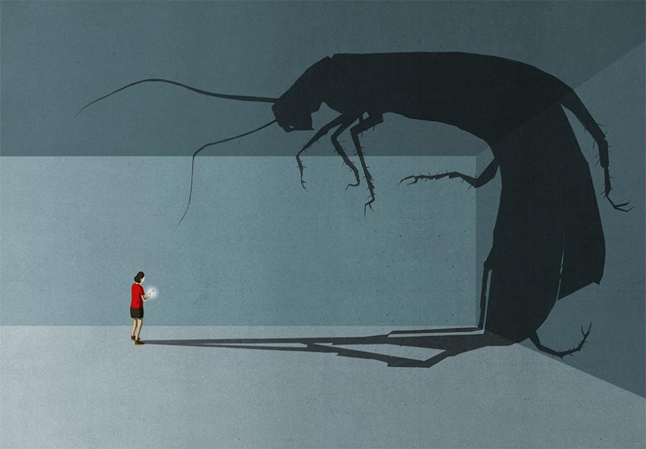 The shadow of a bug looms large over a human figure 