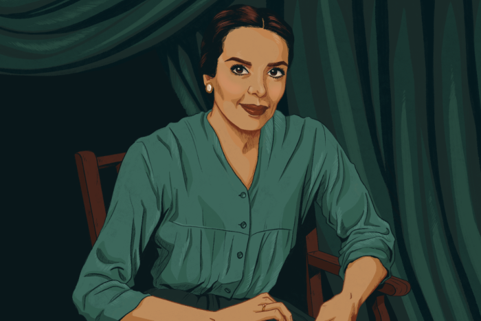 A rendering of Anna Kashfi looks directly at the viewer. She wears a green shirt.